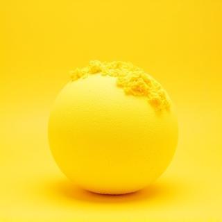 Large yellow bath bomb with citrus slices